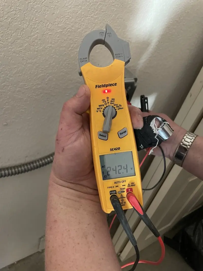 Voltage testing with clamp meter during Electrical Installation Services in Dracut